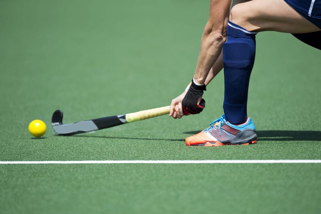 Hockey Player Forcefully Passing the Ball