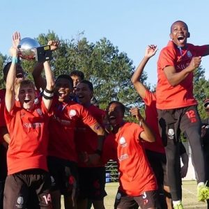 Maritzburg College captain Mateo Horstead raises the Primo Big 10 trophy after College beat Glenwood for the title in July.