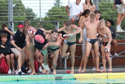 Clifton College's players launch themselves into the pool in celebration of winning the 2024 Vides Water Polo Tournament, taking coach Paul Martin with them. (Photo: TeamPhoto SA)