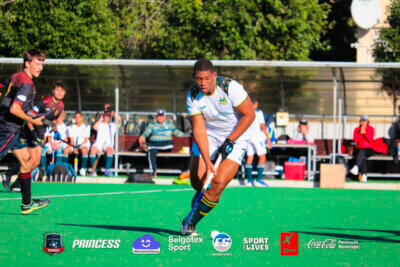 Enzo Whittaker from Fairmont High School on the charge for his team during the Belgotex Sport Easter Hockey Tournament in Cape Town. Fairmont are among the eight teams that have qualified for the quarter-finals. Photo: Belgotex Sport Easter Hockey Tournament 