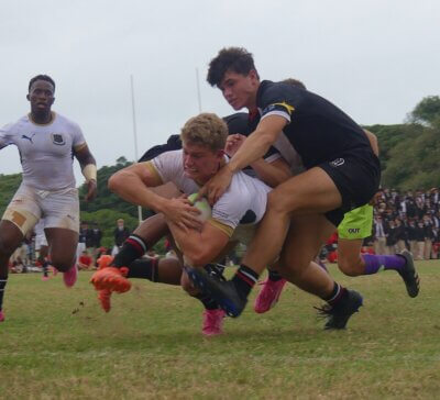 St Charles College captain Stefan Veldsman forces his way over the try line for Saints' third try against Clifton.