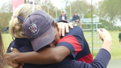 What it means to win the Kearsney Tennis Festival title: Lindo Gcwena hugs Westville Boys' High Director of Sport, Pam Hayward.