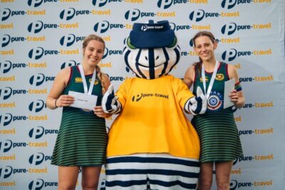 The tournament's top goal scorers, Marika Neethling and Tanya Pieterse, celebrate their feats with the Cape Town International Hockey Tournament's mascot.