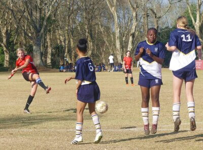 Ashton International Ballito (in red) enjoyed the better of possession and territory against Kloof High, but went down to a 1-2 defeat.