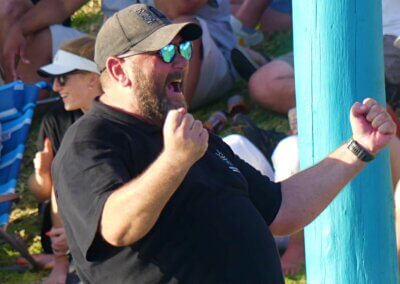 Knowing his side was about to win, KZN coach Rob Ambler celebrated a terrific performance by his side. Photo: Brad Morgan.