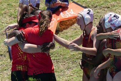 The thrill of victory! Central Gauteng coach Kelsey Thomson hugs her management team while Emma Pelicot (#2) and Tori Tanner-Ellis (#8) close in to share in the hug-fest. Photo: Brad Morgan.