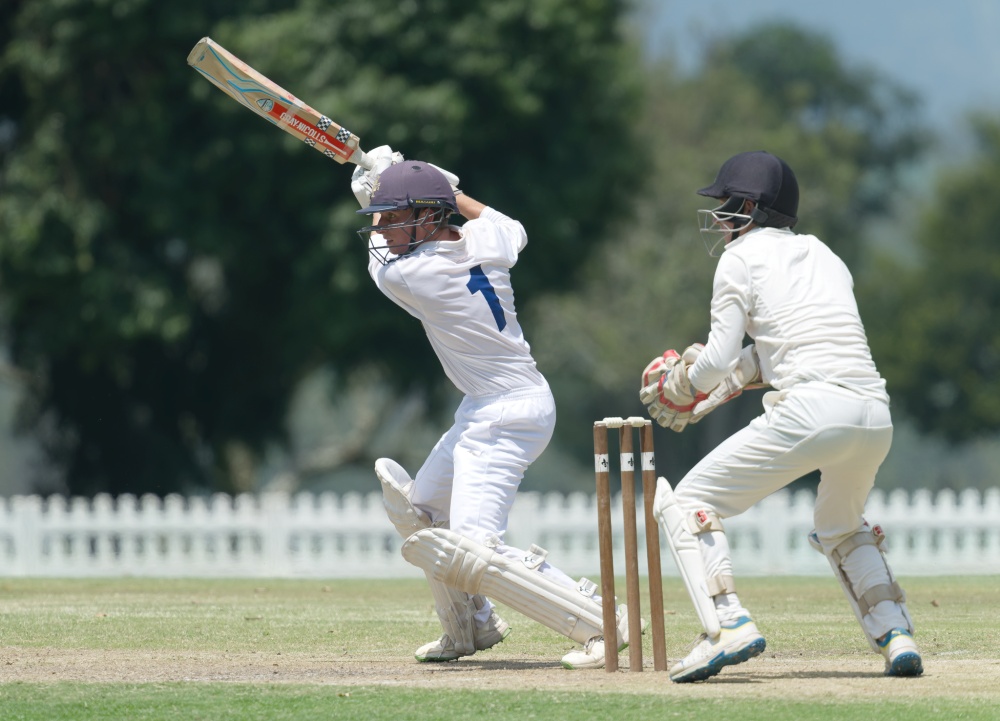Northwood opening batsman, Ross McGlashan, watched by wicketkeeper Ben Wilson, goes on the attack against Hilton College. Photo: Justin Waldman Sports Photography.