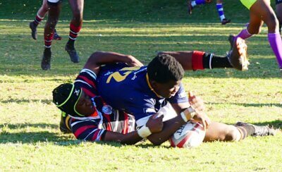 Ama Mataboge crashed over the ty line to give DHS the lead in the first half of an epic battle against Marritzburg College. Photo: Brad Morgan.