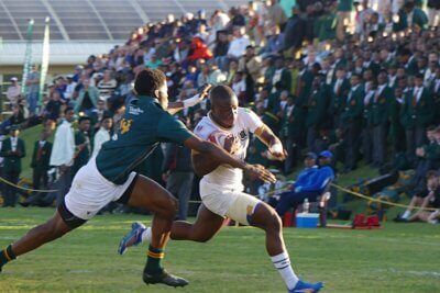 St Charles fullback PJ Dlamini came close to outflanking the Glenwood defence, but right wing Lebohang Skosana stopped him with a fine tackle. Photo: Brad Morgan.